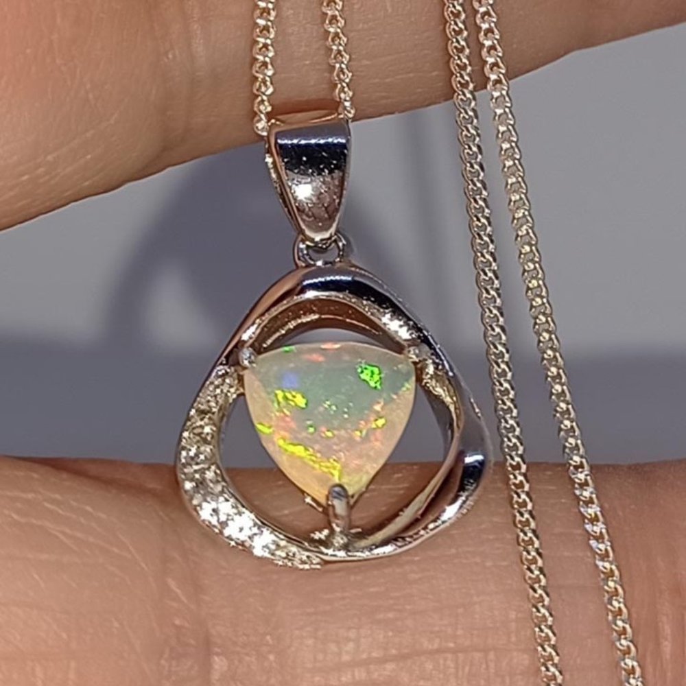 Opal Pendant with Topaz Accents